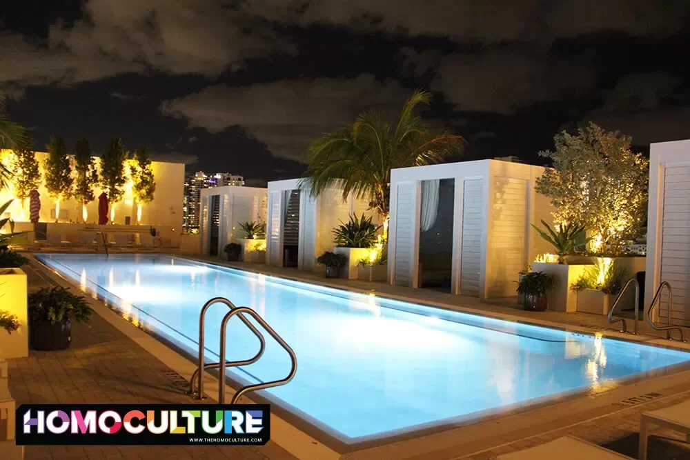 The rooftop pool at night atop the Arlo Wynwood.