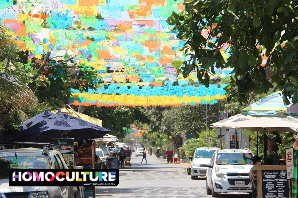Colorful pendants hang over the street in San Francisco, Mexico. 