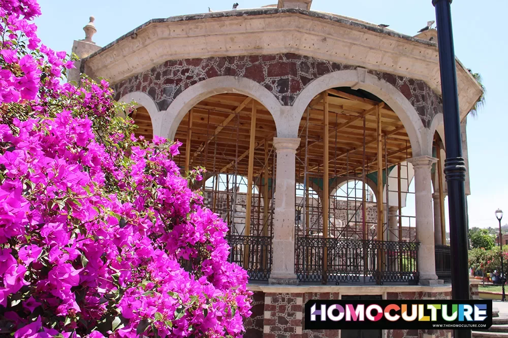 Pink flowers surround an open-air band stage in Compostela, Mexico.