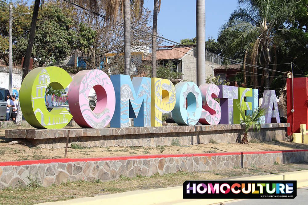 A colorful landmark sign that says Compostela. 
