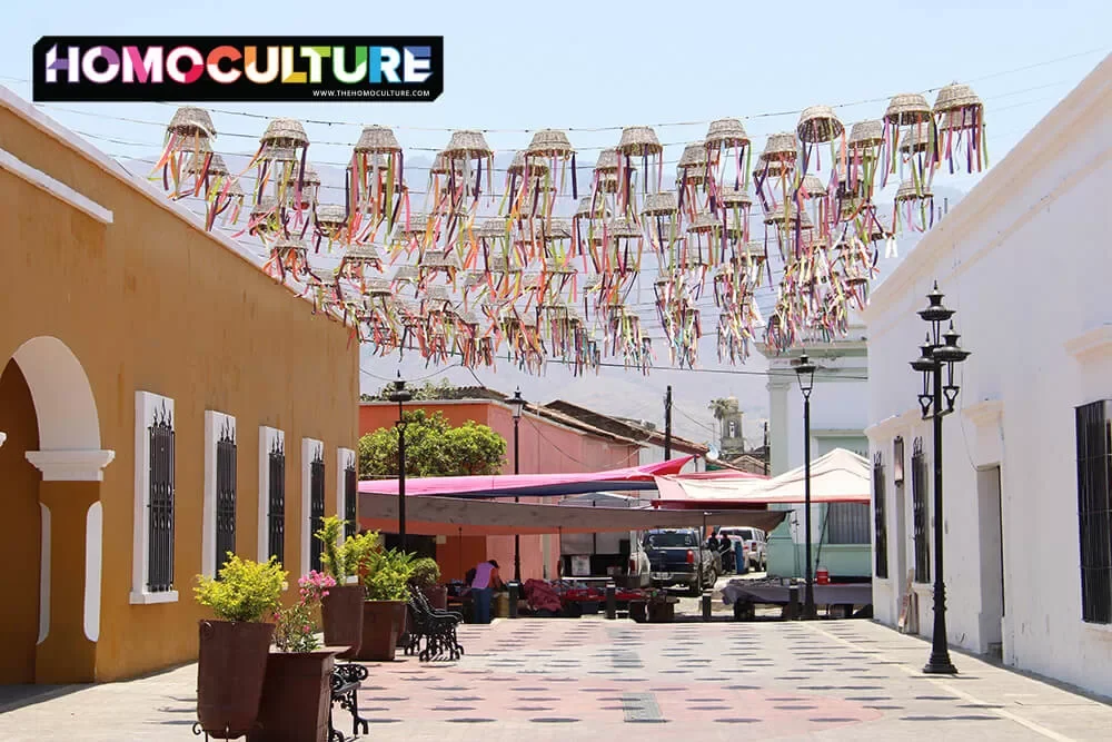 Colorful decorations hang overhead of a plaza in Jala, Mexico. 