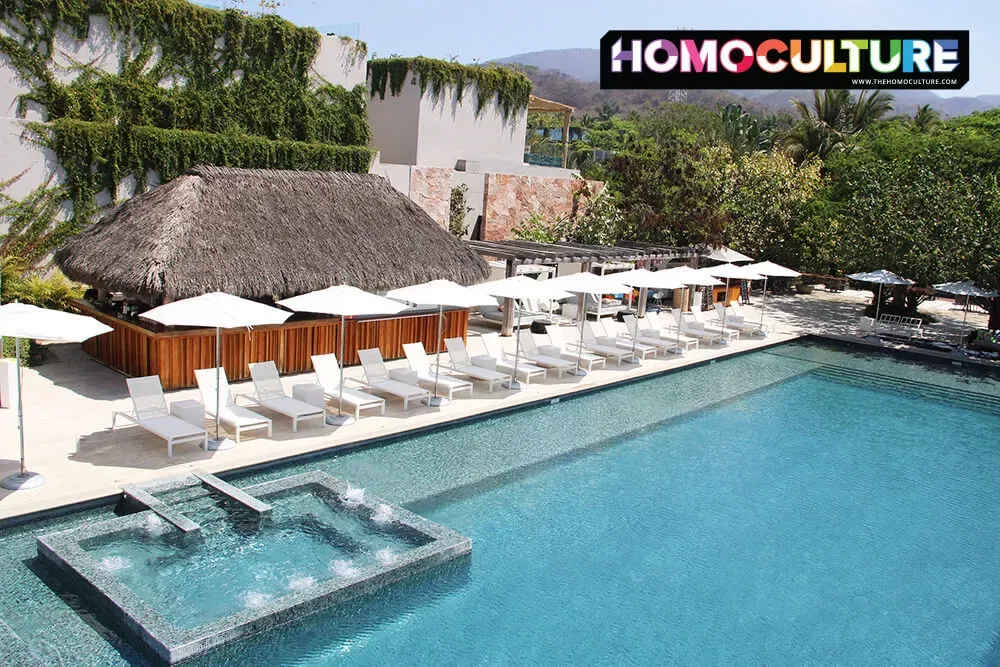 A row of lounge chairs at a public pool at the W Hotel Punta De Mita. 