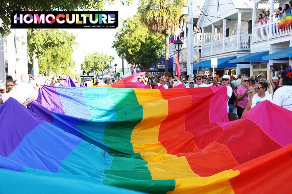 A Pride flag being carried down Duval Street in Key West, Florida, during Key West Pride 2023.
