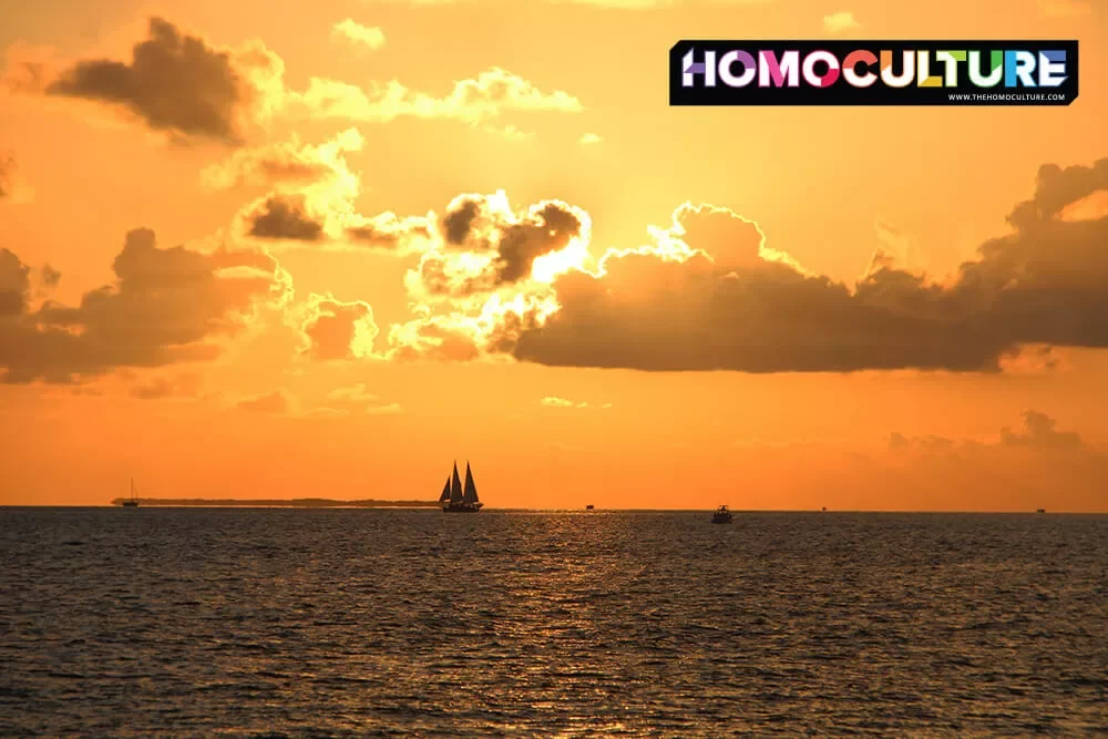 A silhouette of a sail boat at sunset in Key West, Florida. 