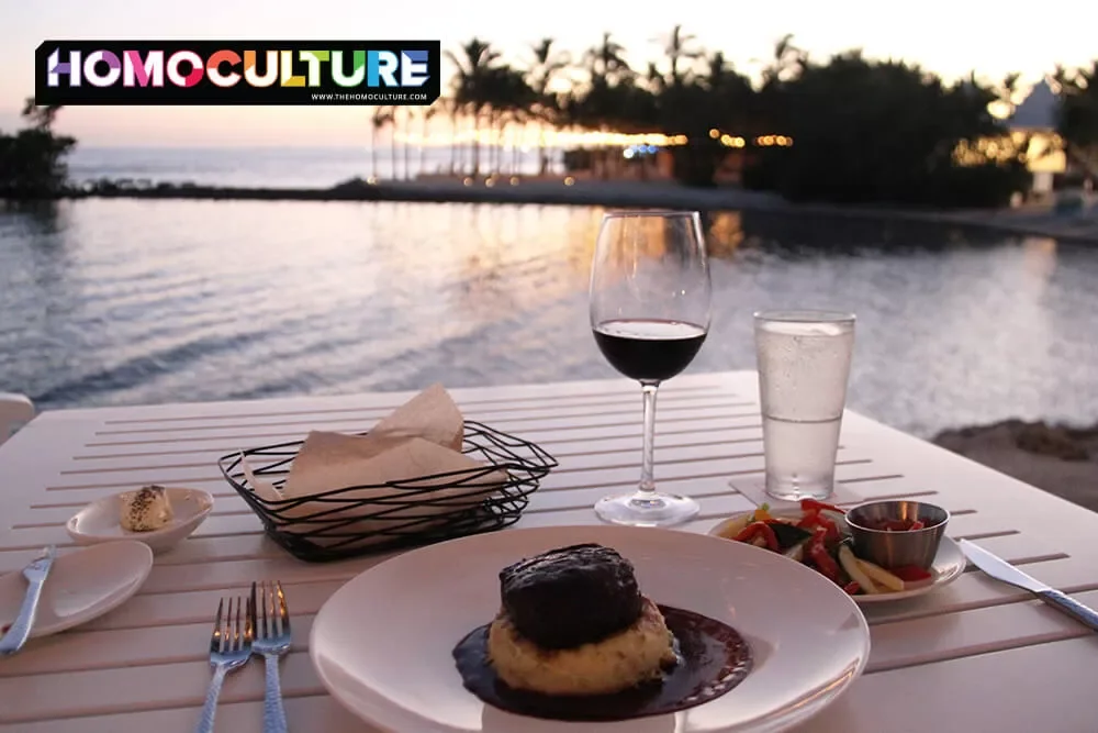 Steak dinner with red wine overlooking the water at sunset at Isla Bella Resort in the Florida Keys.