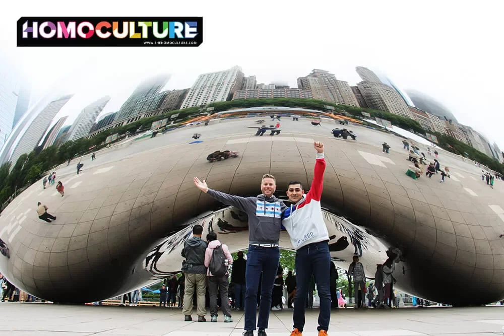 Two friends posing in front of the iconic silver bean in Millennium Park, Chicago.