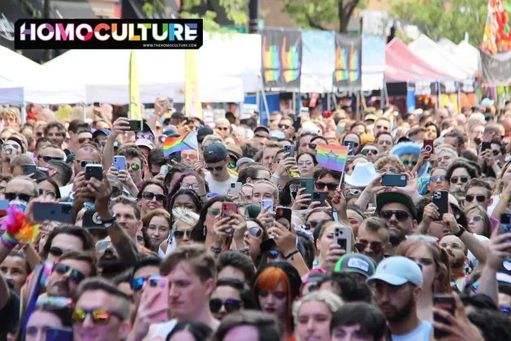 A crowd gathers to watch a live performance on the main stage at Chicago Pride Fest 2023.