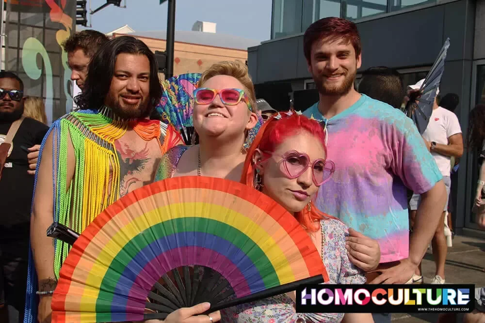 A group of friends wearing colorful outfits at Chicago Pride Fest 2023.