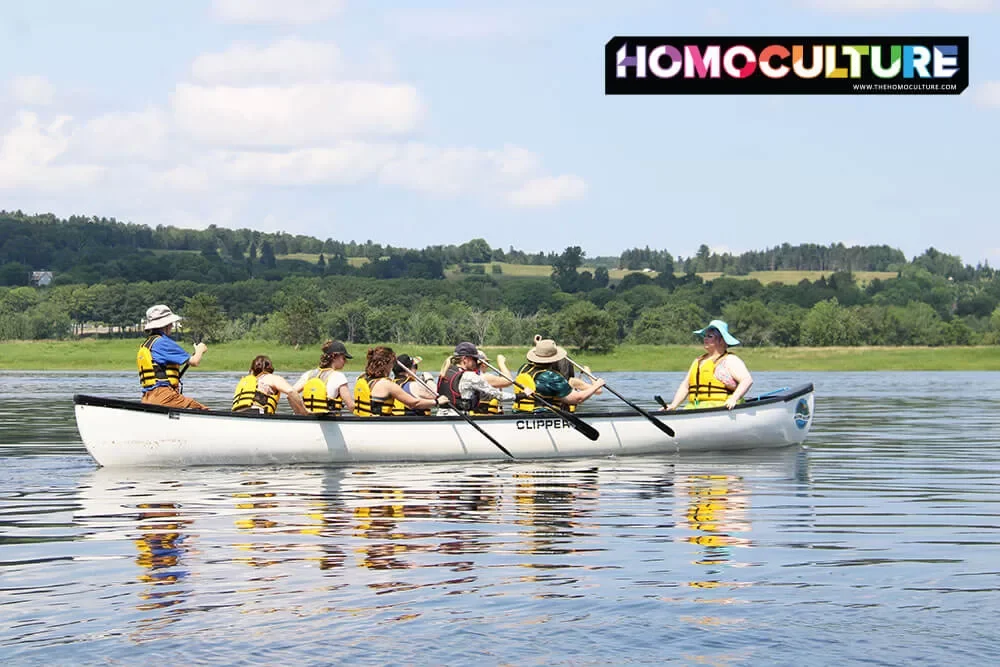 A group paddles their canoe down the Wollaston (Saint John River) for the Big Queer Canoe during Fredericton Pride 2023. 