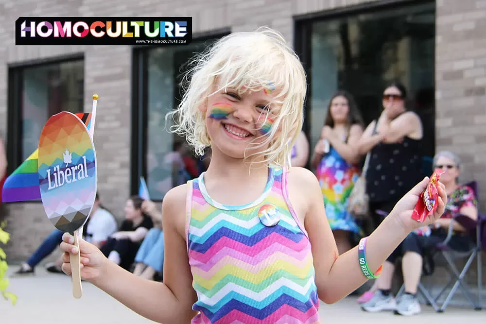 A child decked out in Pride gear at the 2023 Fredericton Pride parade 
