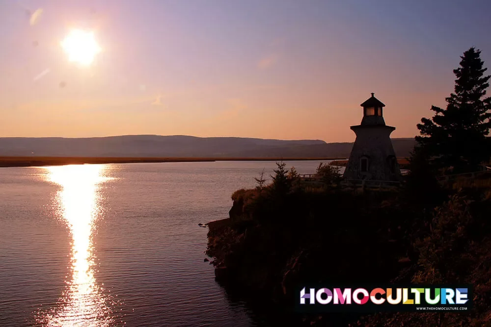 The silhouette of a lighthouse at sunset in New Brunswick. 