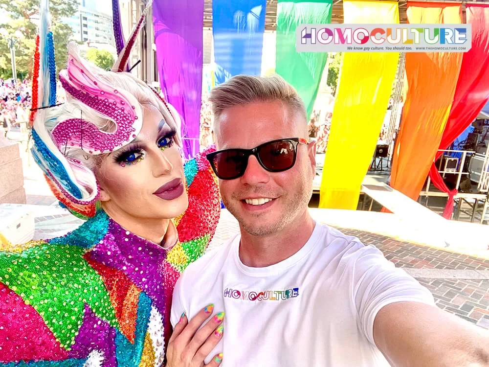 A gay man takes a selfie with a drag queen in Denver, Colorado. 