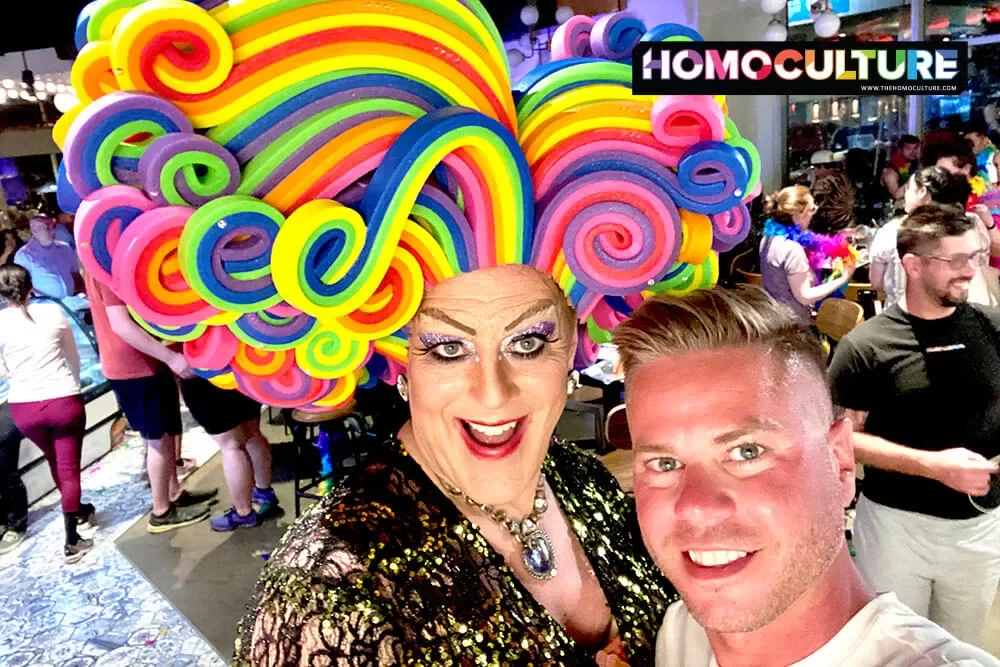 A gay man and a drag queen take a selfie at Denver Milk Market.