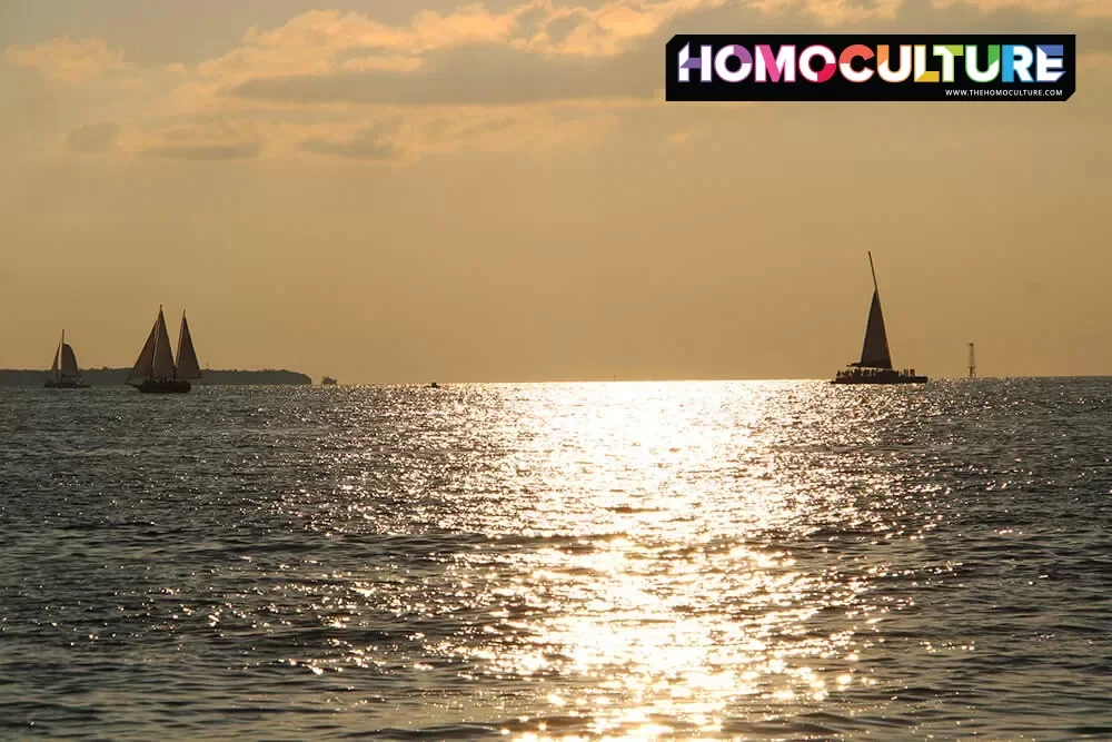 Sailboats on the shimmering water at sunset in Key West, Florida.