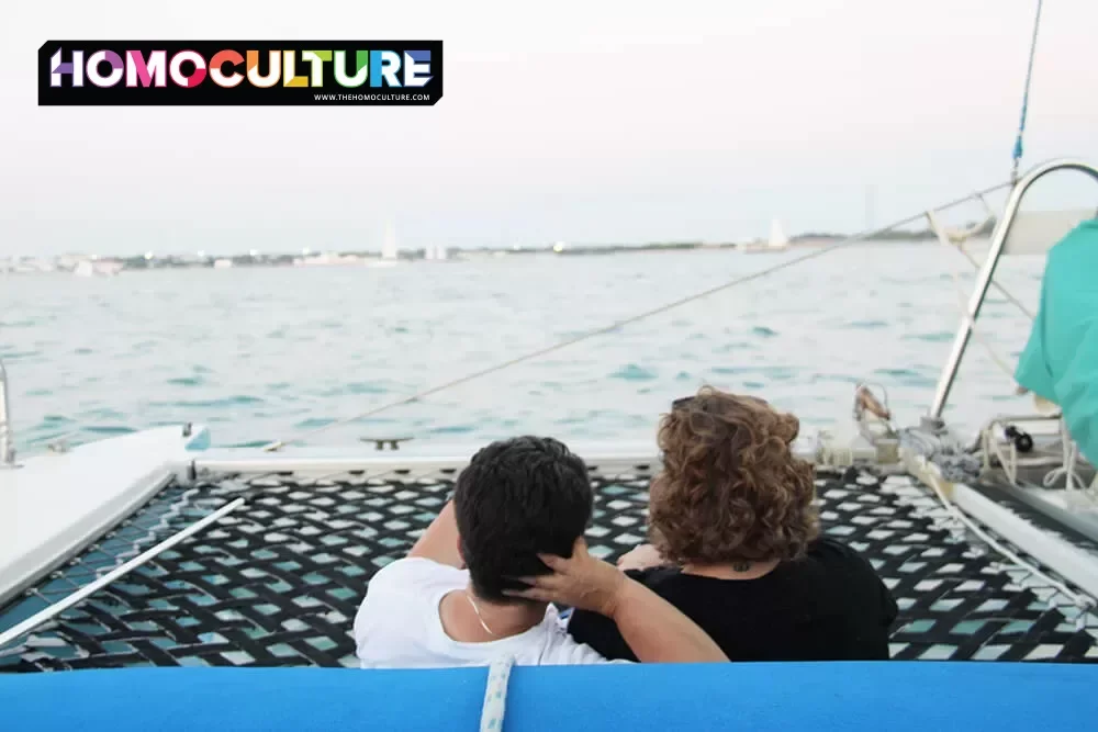 A lesbian couple relaxing on the stern of the Blu Q gay boat cruise in Key West, Florida.