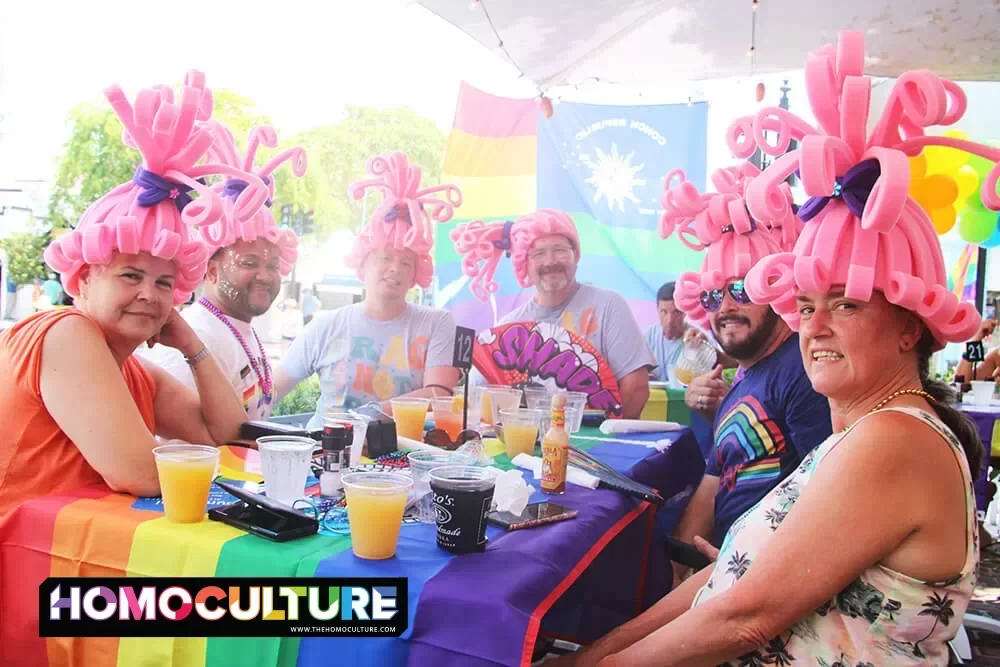A group of people wearing pink wigs during drag brunch at Mangoes Restaurant in Key West, Florida.
