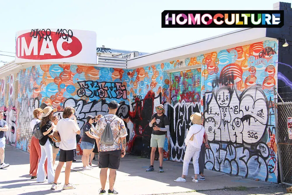 A group learning about the unique stories of the murals in Denver, Colorado. 