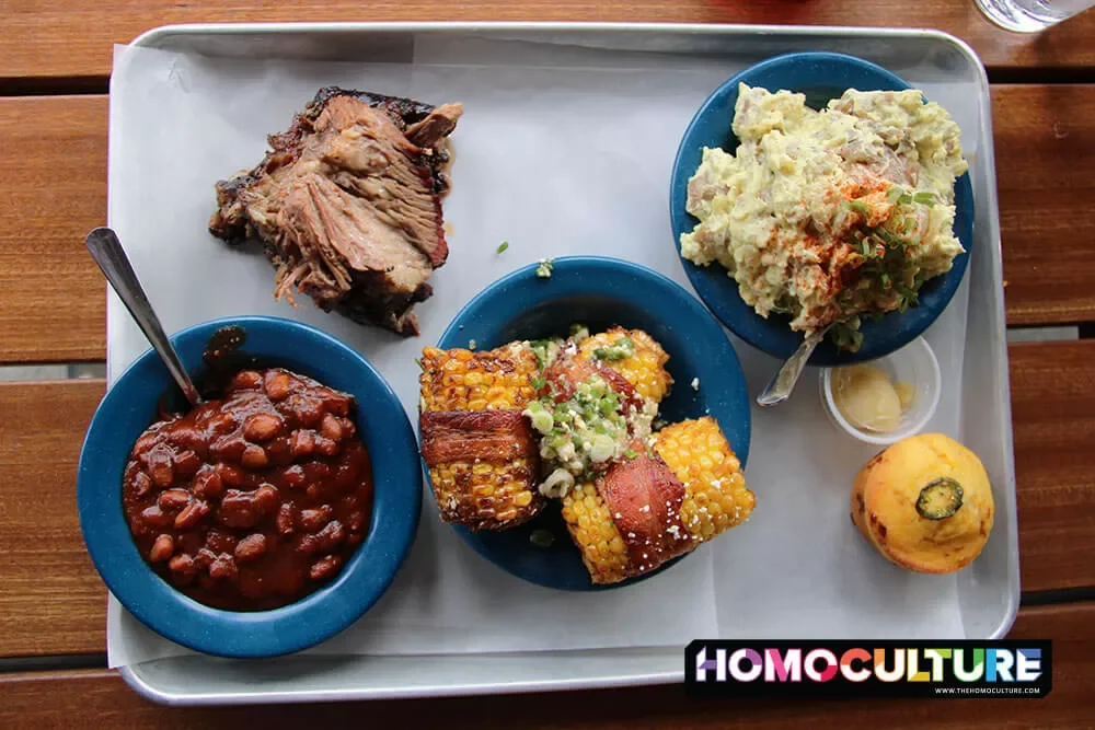 A serving tray full of traditional barbecue fare at Comery Block, a barbecue restaurant in downtown Calgary, Alberta. 