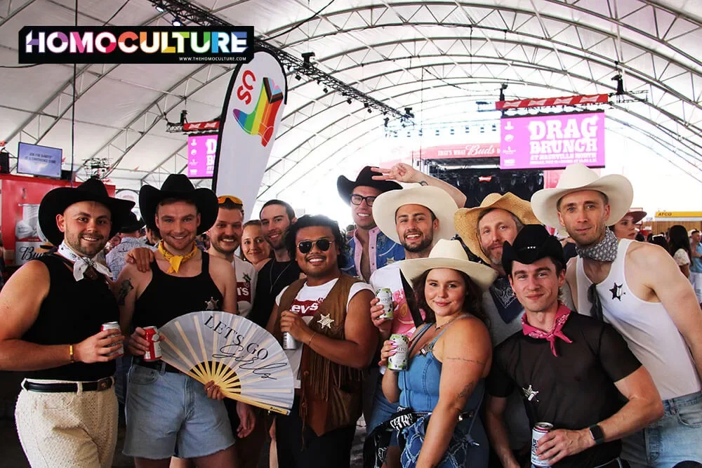 A large group of gay men at Nashville North during Pride Day at the 2023 Calgary Stampede. 