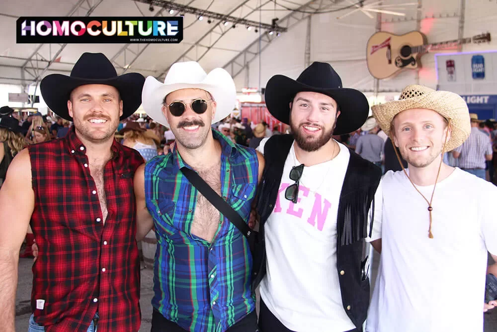 A group of gay men attending the 10th annual Pride Day at the 2023 Calgary Stampede.