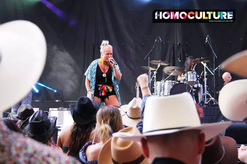 A singer forming on stage at Pride Day during the 2023 Calgary Stampede. 