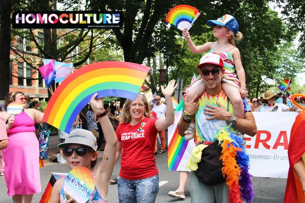 A family attending Fredericton Pride 2023 in Fredericton, New Brunswick. 