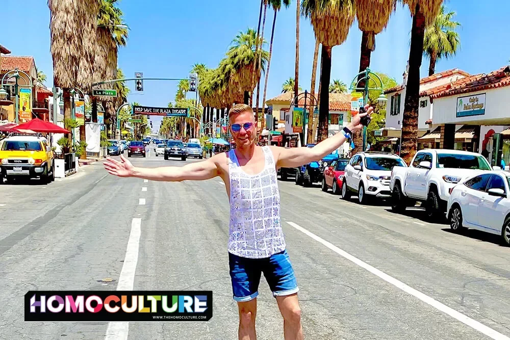 A gay man in a white sequin tank top in downtown Palm Springs, California.