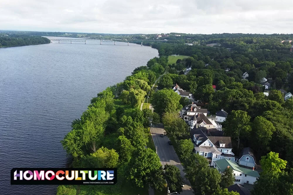 A row of large houses along the Wolastoq River in Fredericton, New Brunswick.