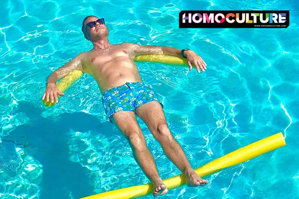 A man floating in the pool at the Kimpton Lighthouse Hotel in Key West, Florida. 