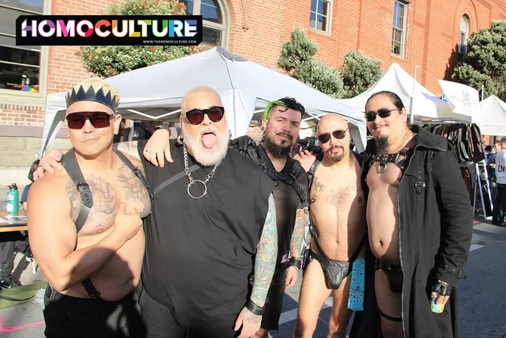 A group of friends posing for a photo at Folsom Street Fair 2022.
