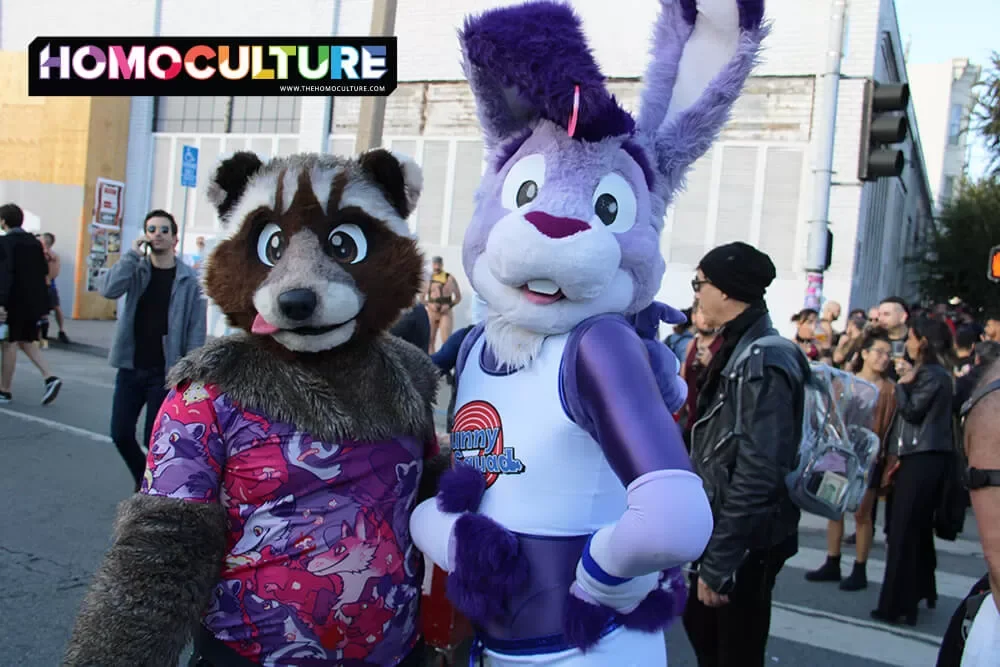 Two people dressed in furry fetish outfits at Folsom Street Fair 2022. 