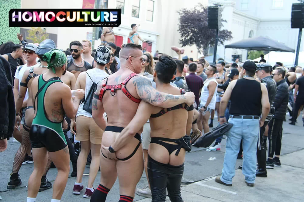a gay couple holding each other at Folsom Street Fair 2022 in San Francisco. 