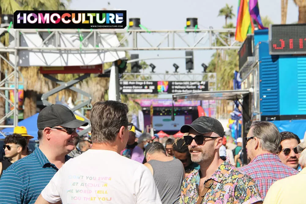 Friends chatting at the 2022 Palm Springs Pride block party. 