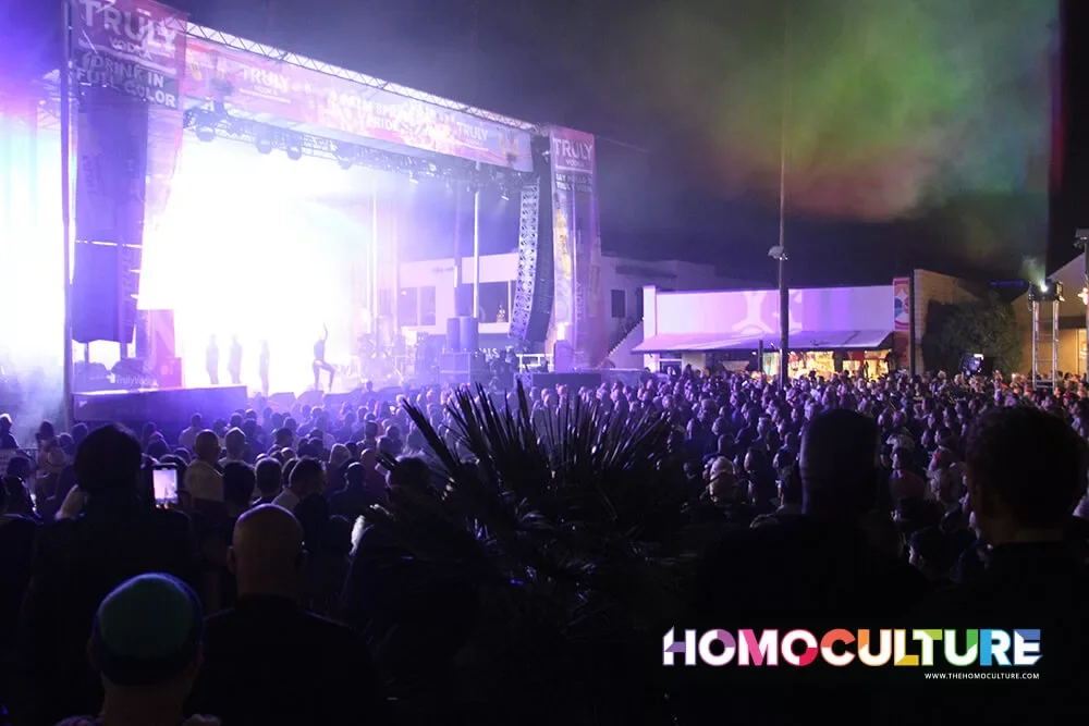 A large crowd watches live performances at the 2022 Palm Springs Pride Festival. 