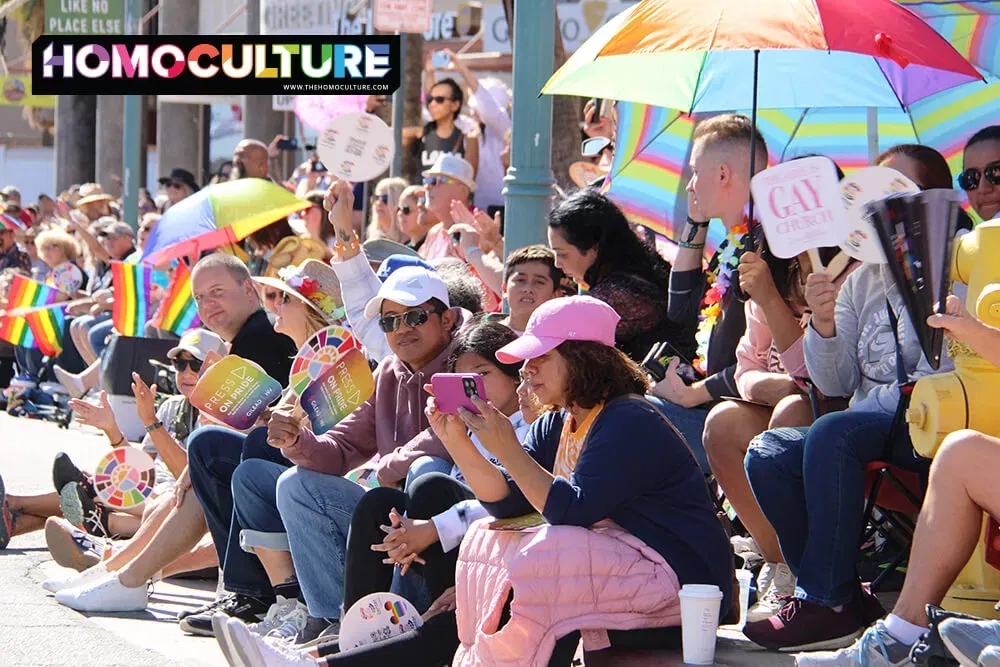 Large crowds watching from the sidewalks at  the 2022 Palm Springs Pride parade. 