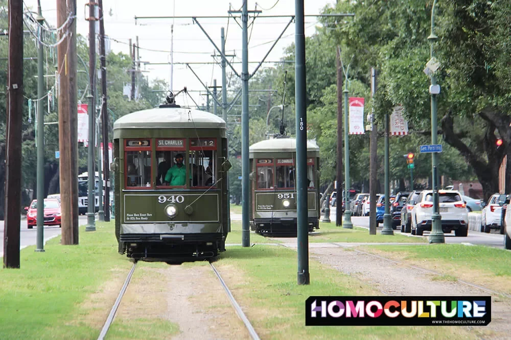 Two street cars pass on the garden line in New Orleans.