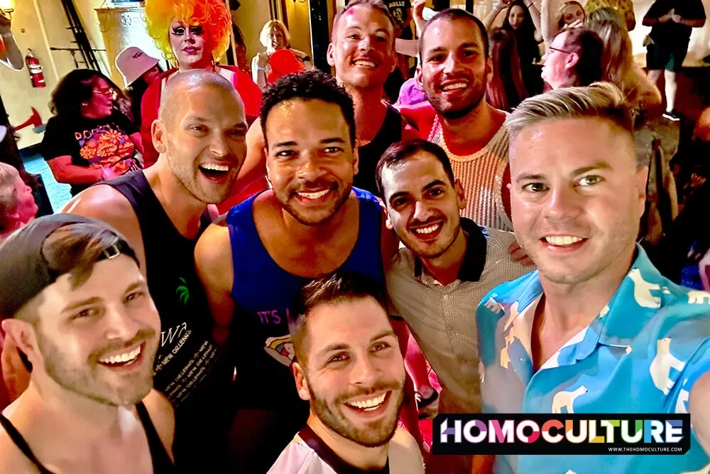 A group of gay men having fun at a drag show aboard the Creole Queen in New Orleans.
