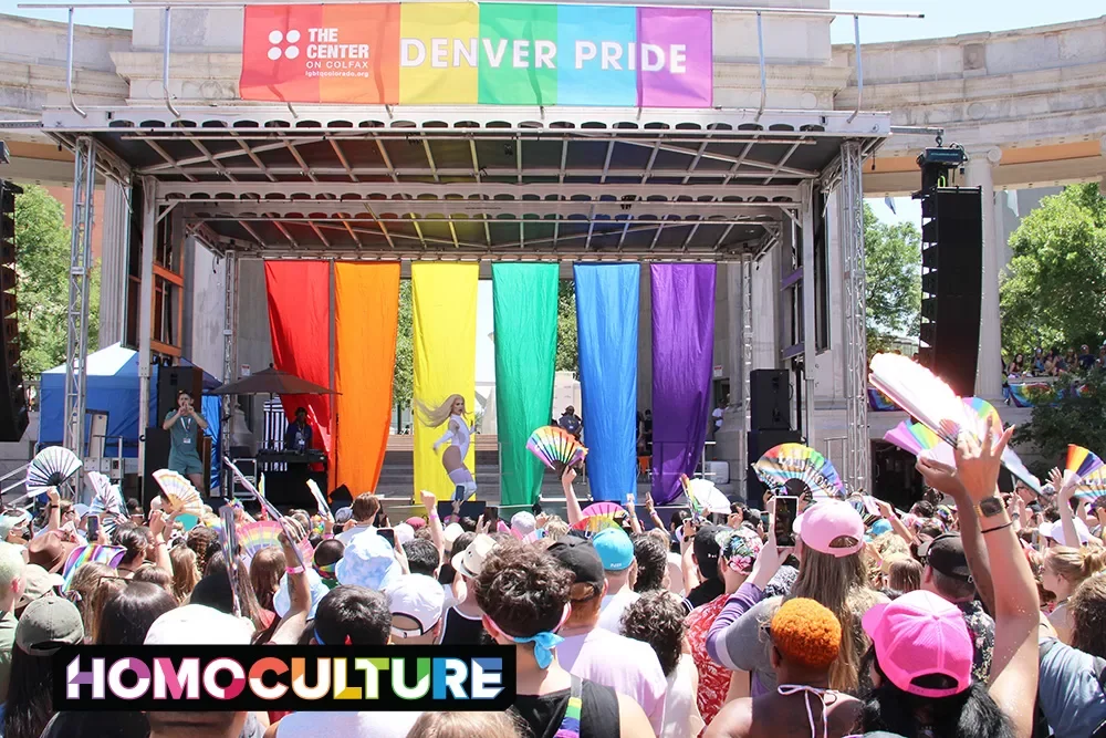 A large crowd watches a live drag show at Denver PrideFest main stage during Denver Pride 2023.