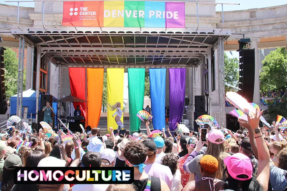 A large crowd watches a live drag show at Denver PrideFest main stage during Denver Pride 2023.