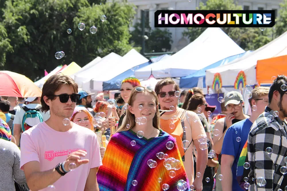 A crowd of people walking through Denver PrideFest 2023. 
