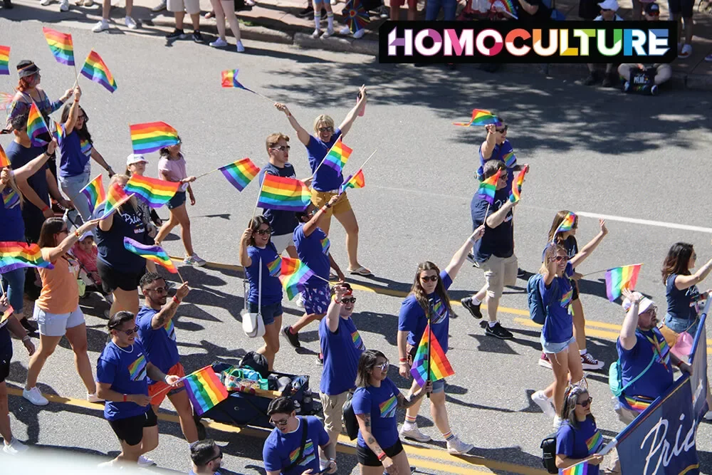A group of marchers waiving Pride flags in the 2023 Denver Pride Parade. 
