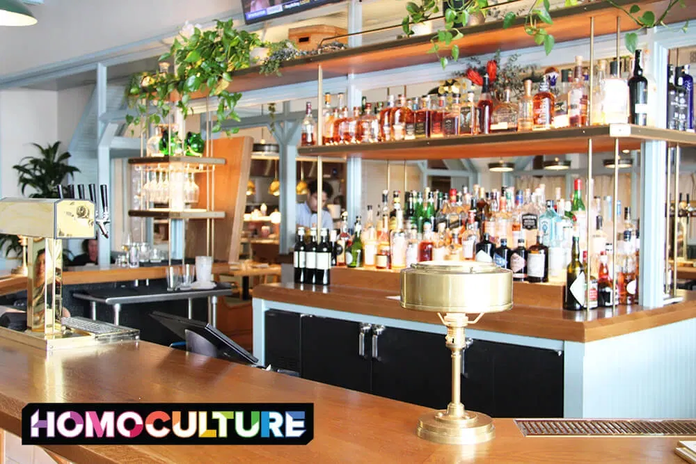 A bar with a wall of liquor bottles at the Halcyon, a Hotel in Cherry Creek, in Denver, Colorado. 