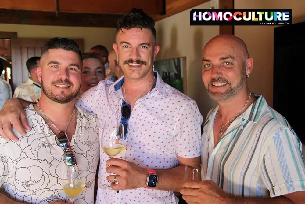 A group of friends tasting wine at the Twilight T-Dance during Gay Wine Weekend 2023. 
