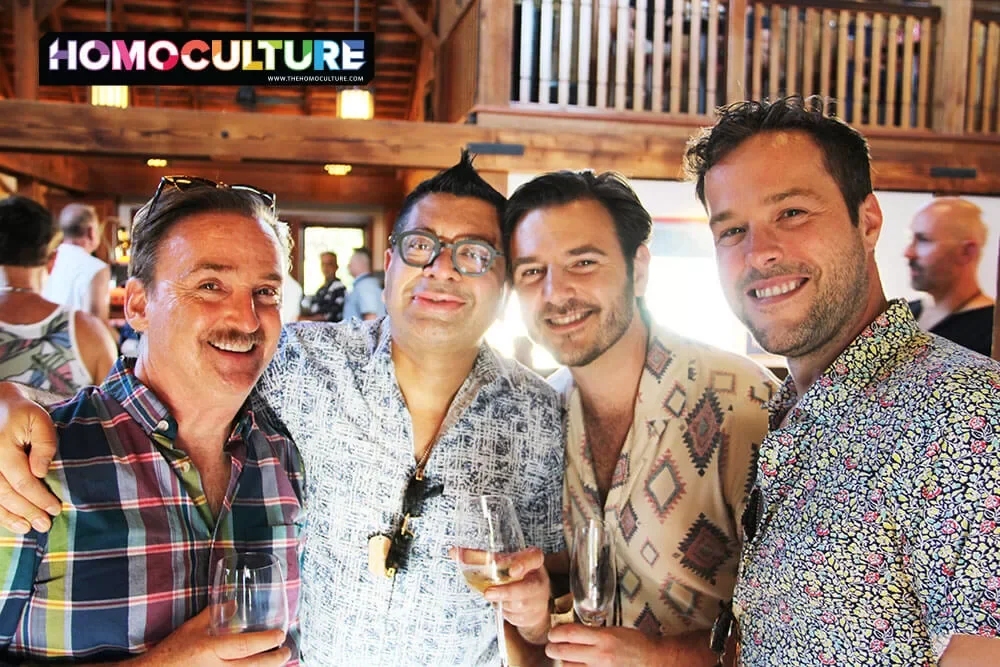 A group of friends pose for a photo during the Twilight T-Dance reception at Gay Wine Weekend 2023. 