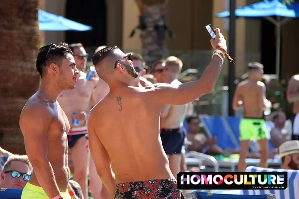 Friends taking a selfie at White Party Palm Springs. 