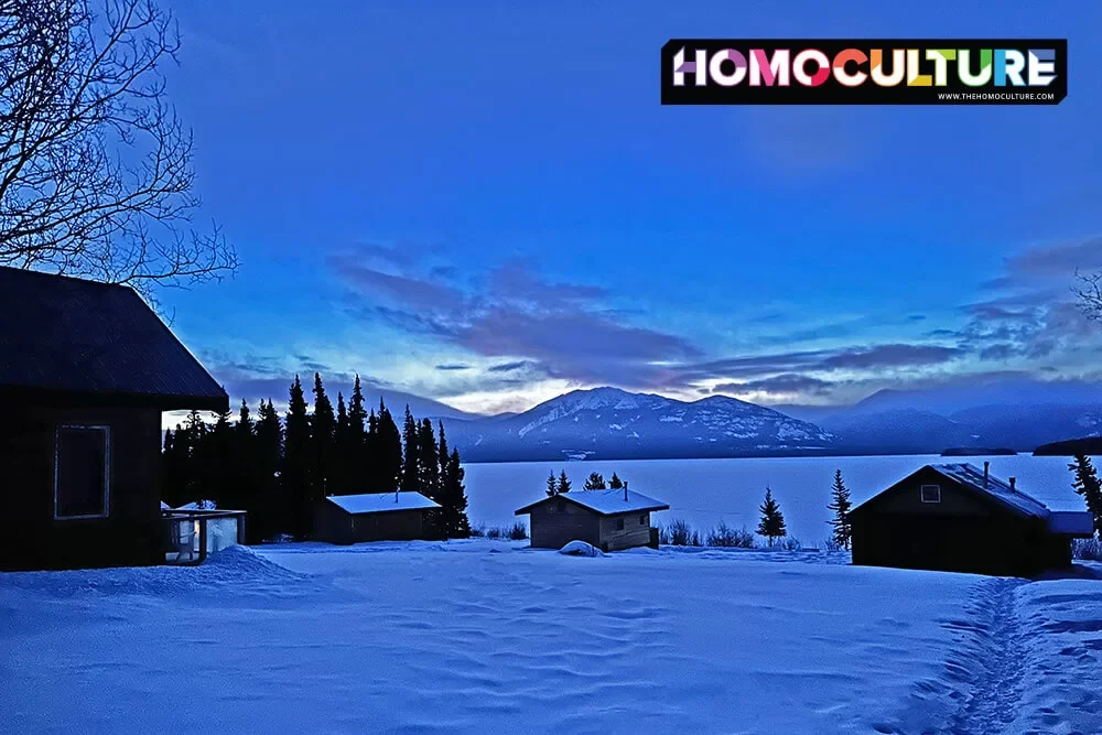 Cozy cabins on a winter evening, near Tagish Lake, in the Yukon.