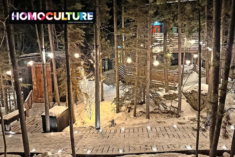 Fairylights illuminate the pathways to the Black Spruce Cabins on a winter night in Whitehorse, Yukon.