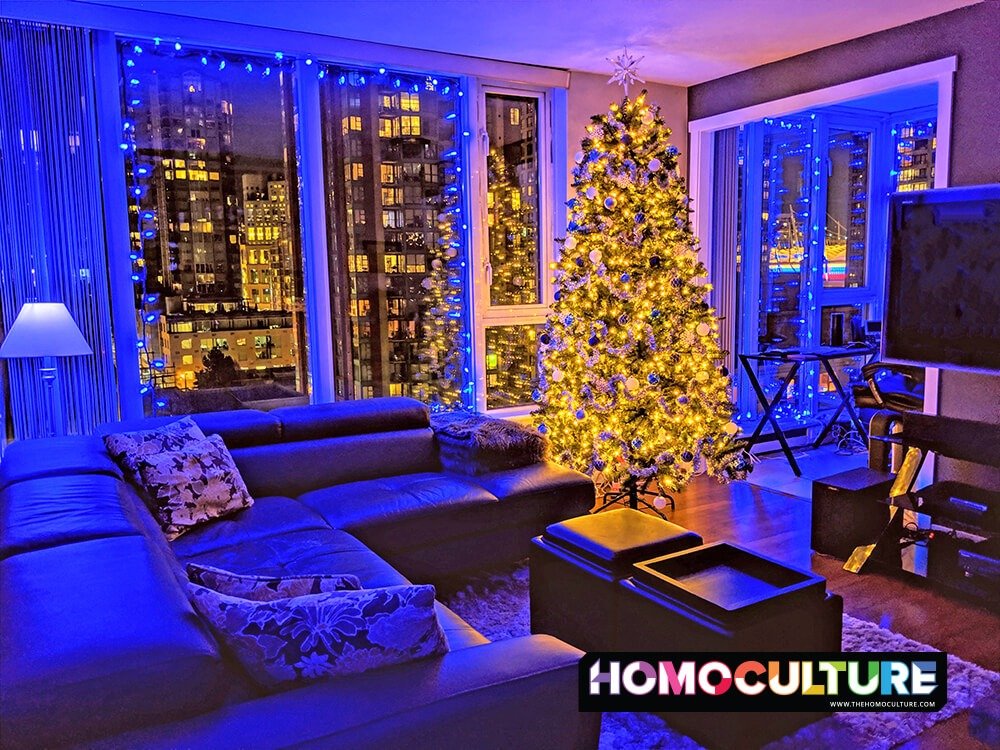 A home decorated for the holidays, with blue Christmas lights.