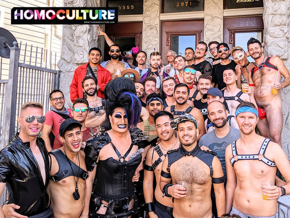 A large group of gay friends wearing leather harnesses and fetish gear. 