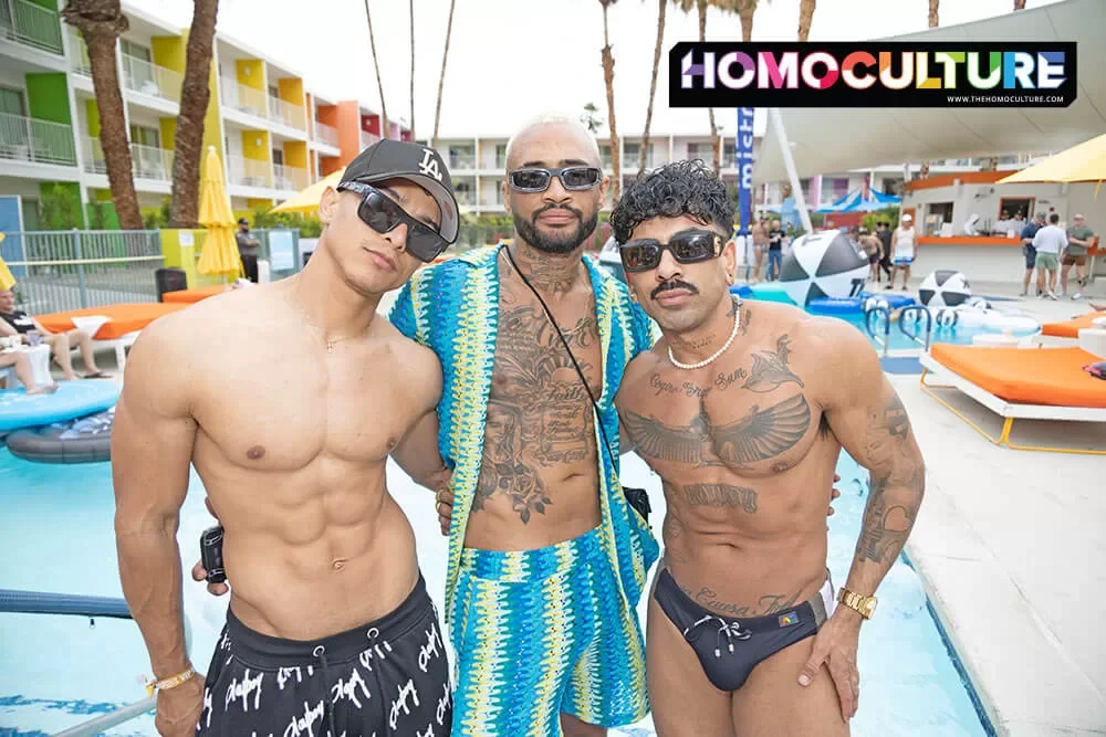 A group of friends having fun, despite the overcast skies, at the White Party Palm Springs 2024  Mermen Pool Party. 